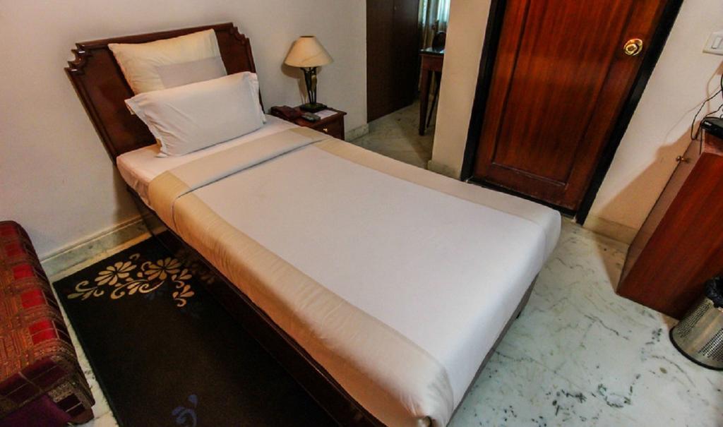העיר בנגלור Hotel Pigeon International חדר תמונה